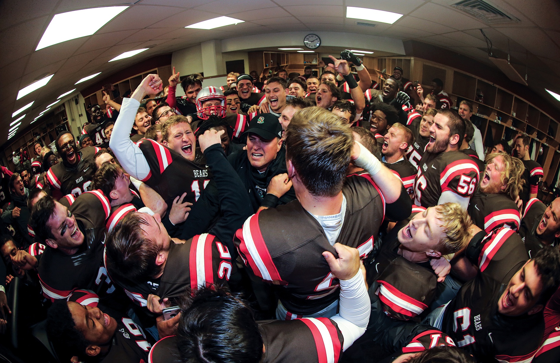 Estes and the Bears celebrate a win over URI at the 2015 Governor&rsquo;s Cup.